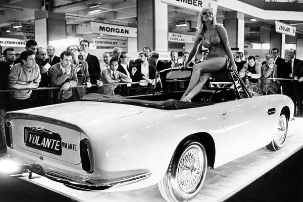 Monika Dietrich On Top Of Aston Martin DB6 Volante at 1966 at Earls Court London Motor Show